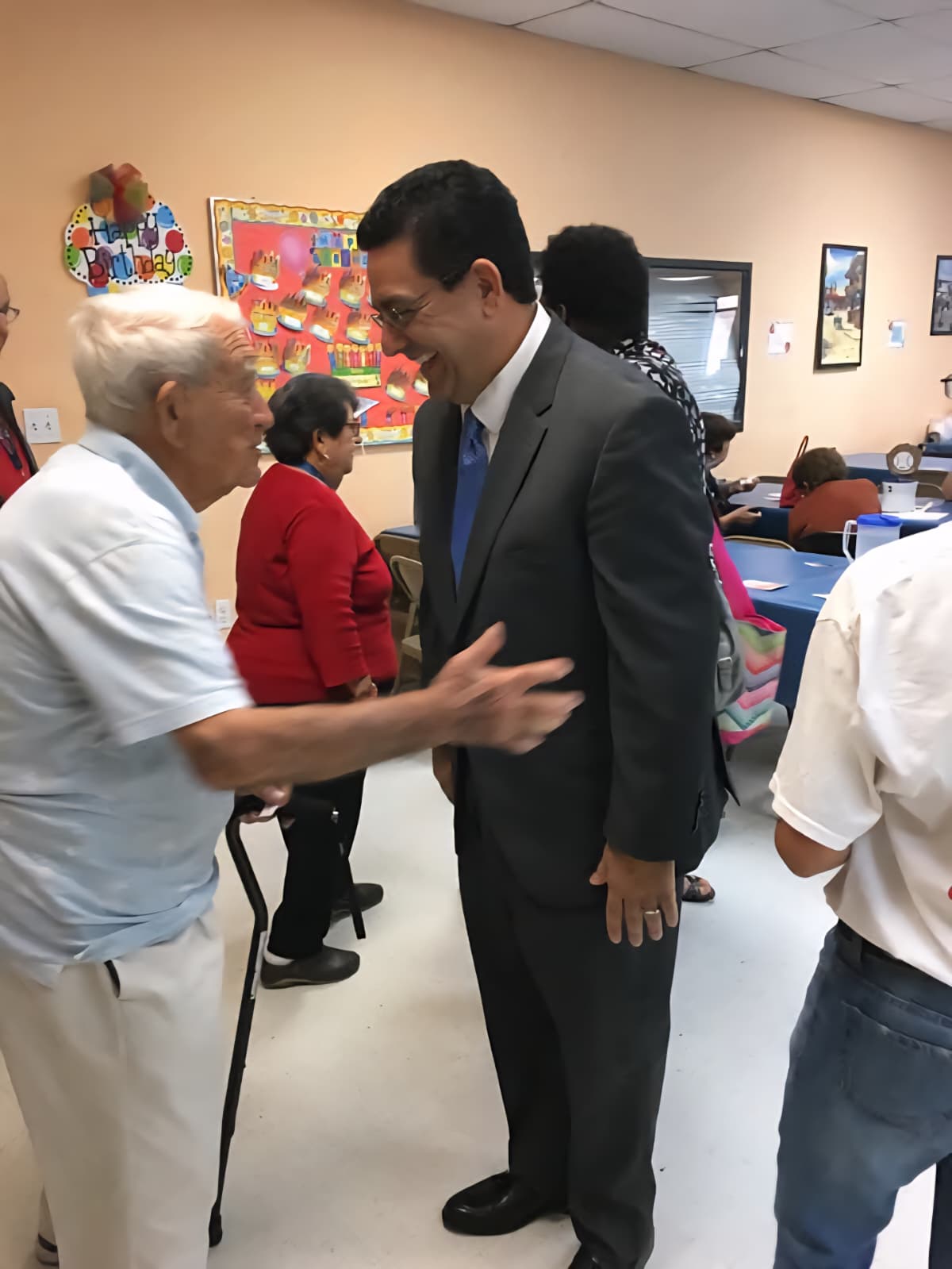 Christopher Pracitto greeting a community member